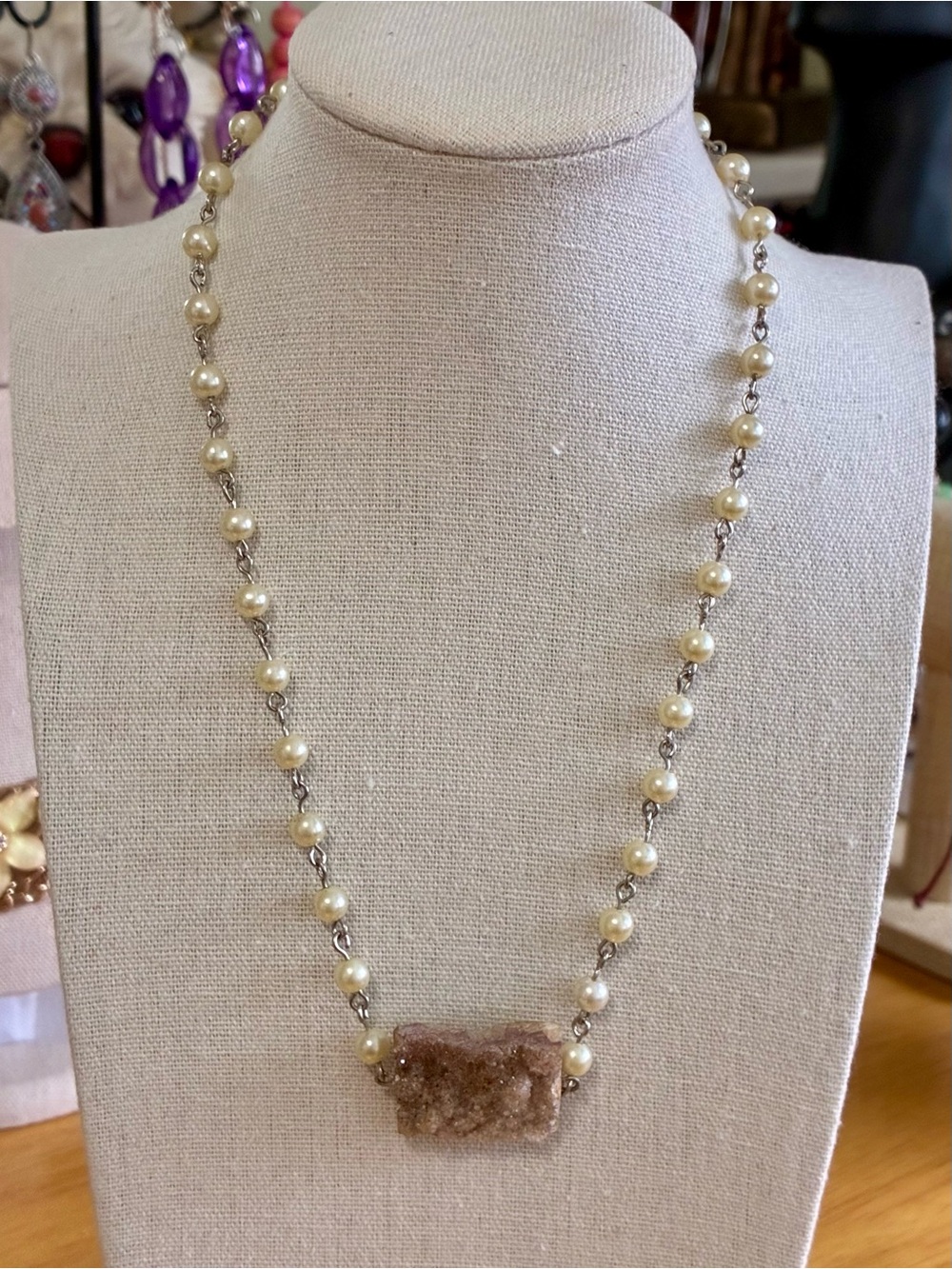 Silver-tone chain Necklace accented with faux pearls.